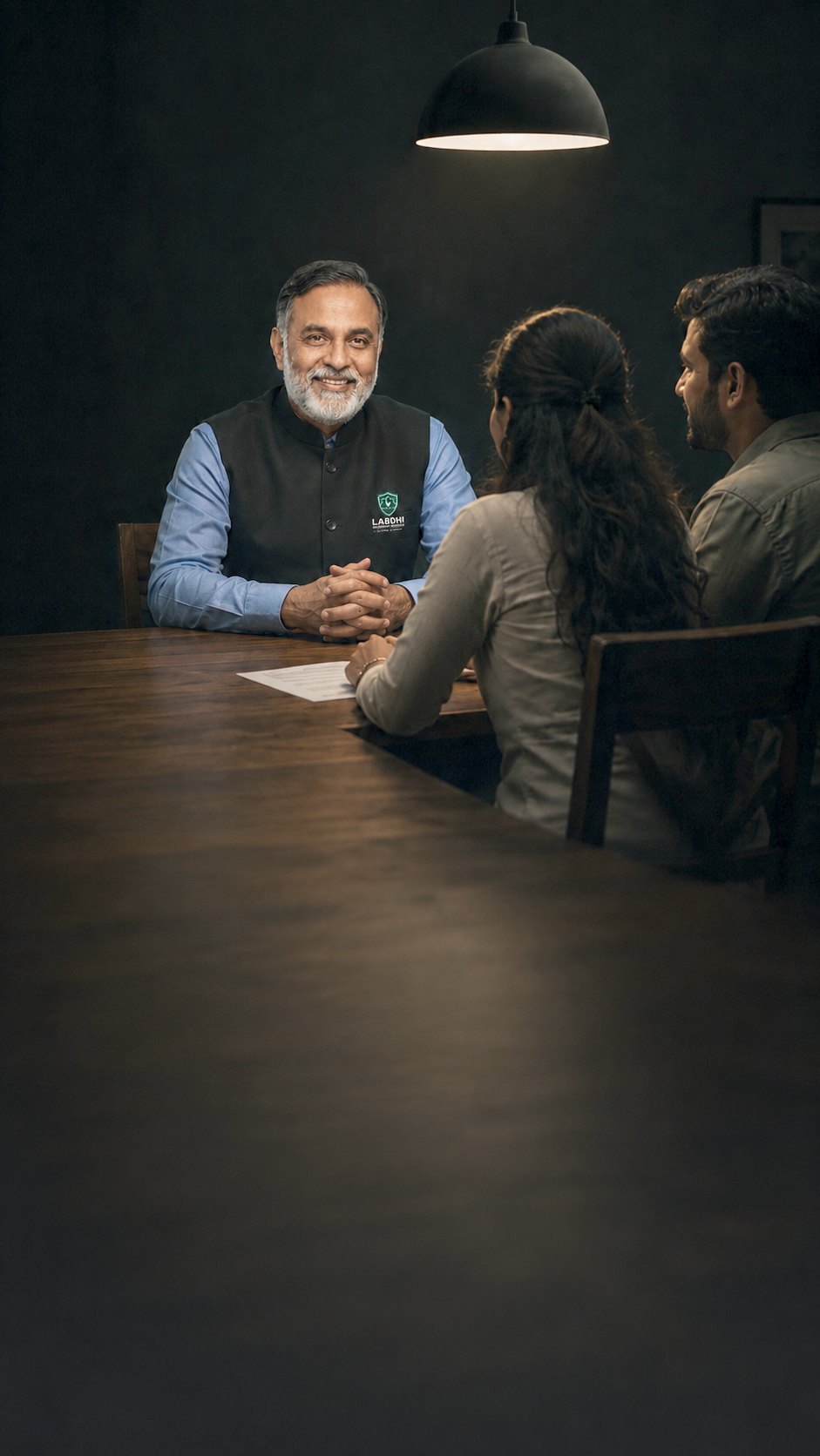 A Labdhi expert going through cover options with a couple